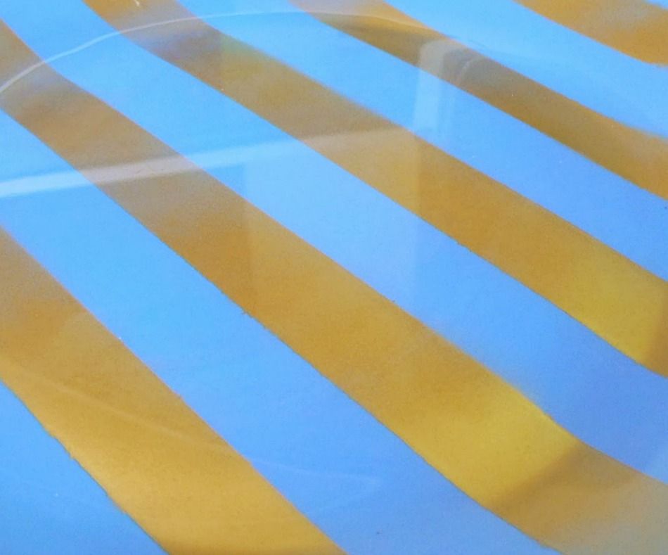 Blue and gold stripes on glass plate