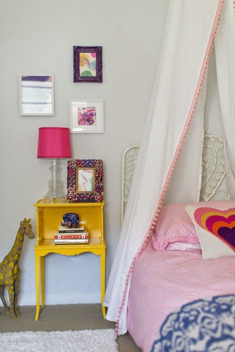 9 Erika Brechtel girls bedroom pink blue yellow DIY canopy peacock headboard framed artwork