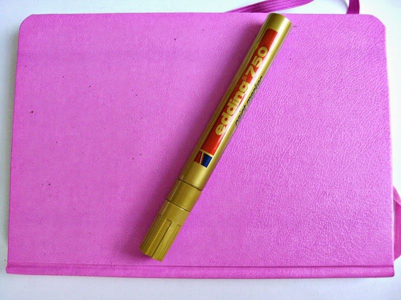 Pink notebook, gold marker