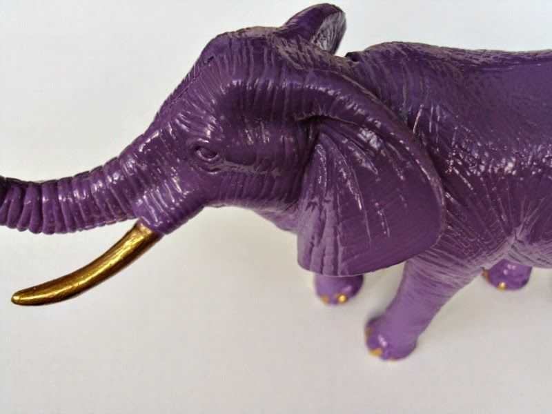 Purple plastic elephant with gold details
