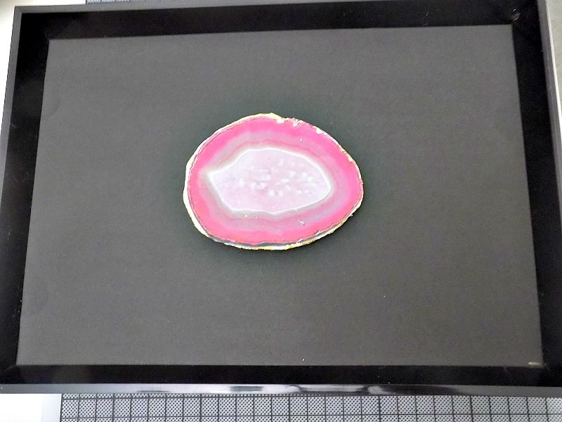 Pink agate slice in a frame