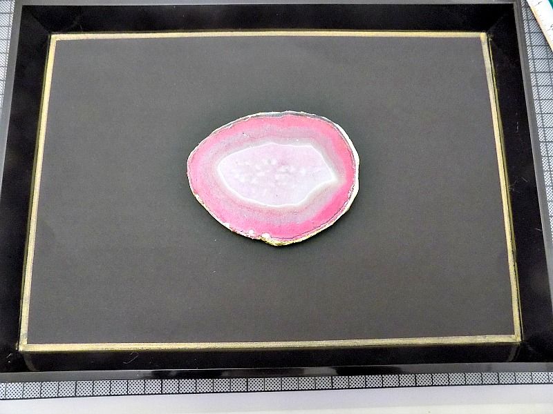 Pink agate slice in a frame