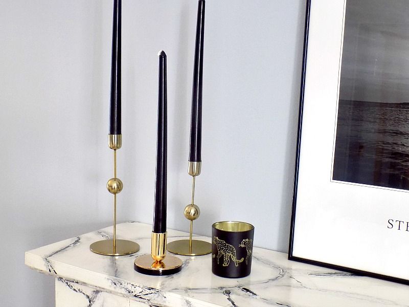 Mantel decoration, brass candle holders, black candles